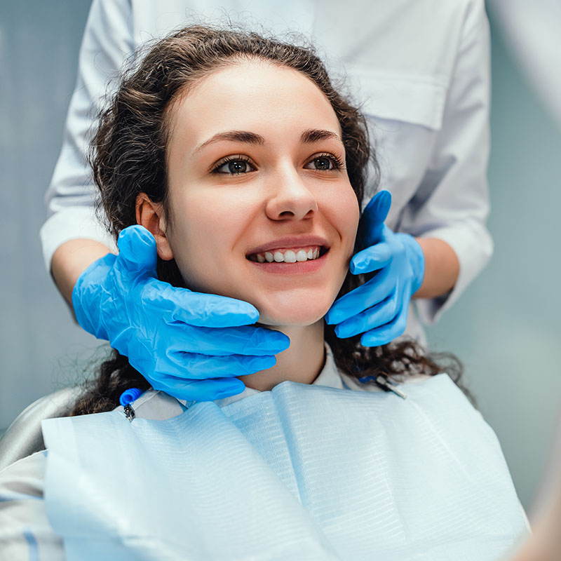 Woman is sitting at a dentist's reception